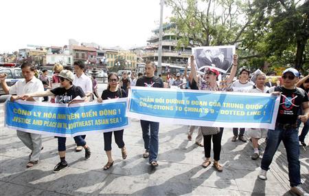 Protesters chant anti-China slogans while marching during an anti-China protest in Hanoi