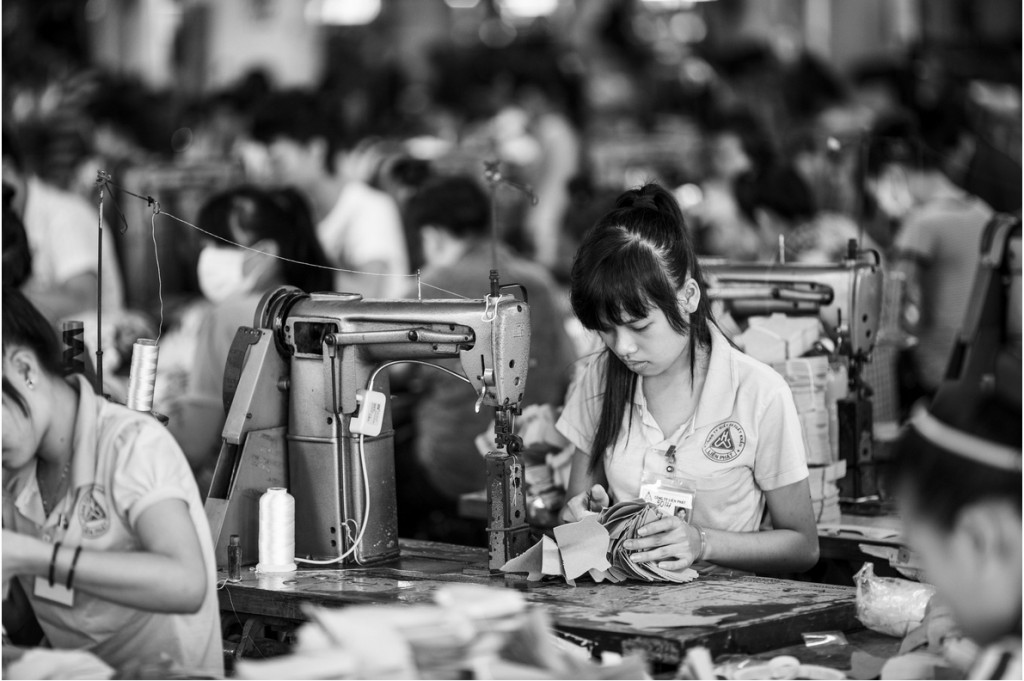 Photo: A factory making shoes (United Development) in Vietnam. US shoe import tax. Source: Aaron Joel Santos / The New York Times
